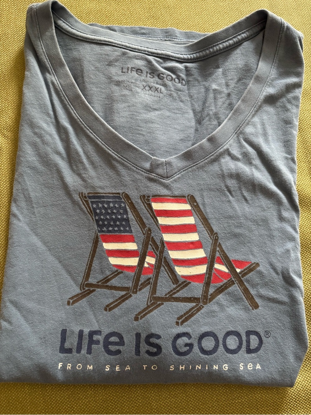 Life Is Good blue V-Neck Tee with American Flag Deck Chair Graphic